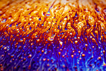 Beautiful psychedelic abstraction formed by light on the surface of a soap bubble.
