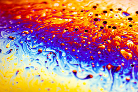 Beautiful psychedelic abstraction formed by light on the surface of a soap bubble.の写真素材