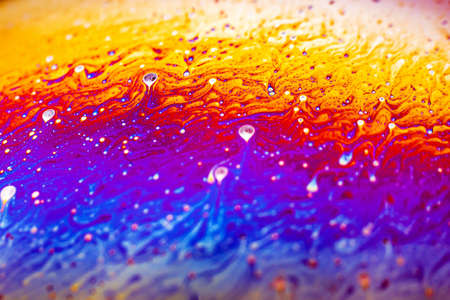 Beautiful psychedelic abstraction formed by light on the surface of a soap bubble.の写真素材