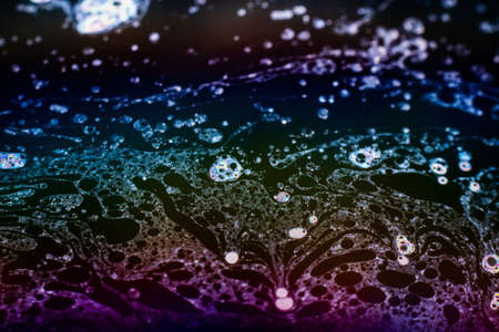 Beautiful psychedelic abstraction formed by light on the surface of a soap bubble.の写真素材