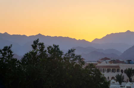 Resort hotels against the backdrop of the mountains during sunset, Sharm El Sheikh, Egypt.