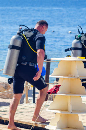Sharm El Sheikh, Egypt May 12, 2019: group of people in swimsuits and wetsuits on a pier at sea.のeditorial素材