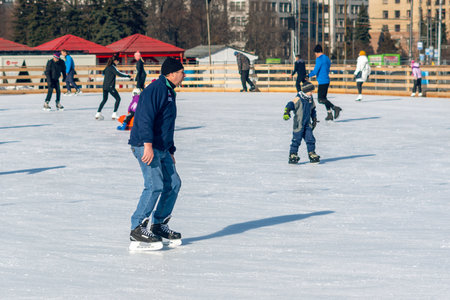 Kharkiv Ukraine, February 21, 2020: Skating rink in the central square of the city, people are skating.のeditorial素材