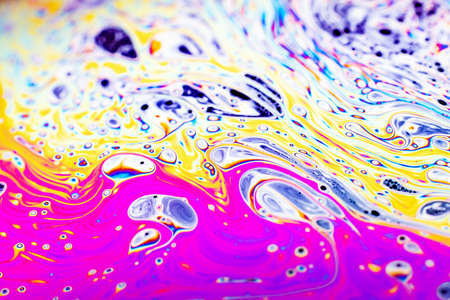 Beautiful psychedelic abstraction formed by light on the surface of a soap bubble.の写真素材