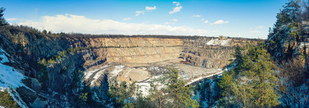 Panorama of a stone quarry for the production of crushed stone and gravel for use in construction.