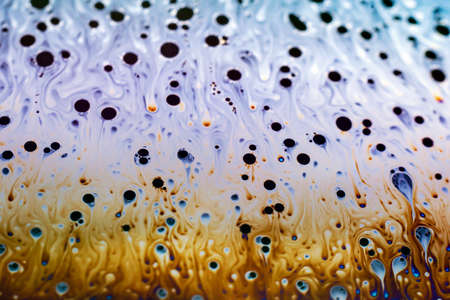 Beautiful psychedelic abstraction formed by light on the surface of a soap bubble.