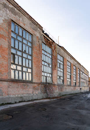 Old crumbling factory building, wall collapse danger.の写真素材