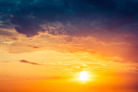 Beautiful colorful dramatic sky with clouds at sunset or sunrise.の写真素材