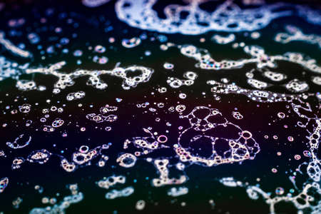 Beautiful psychedelic abstraction formed by light on the surface of a soap bubble.の写真素材