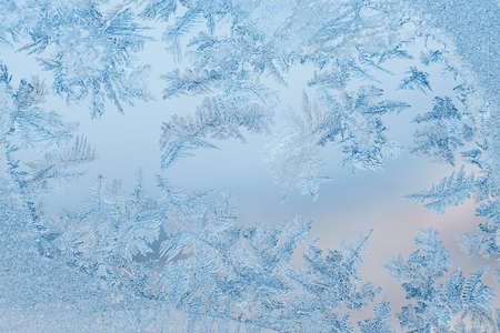 Abstract frosty pattern on glass, background texture.