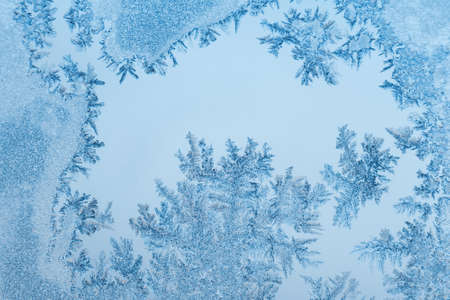Abstract frosty pattern on glass, background texture.の写真素材