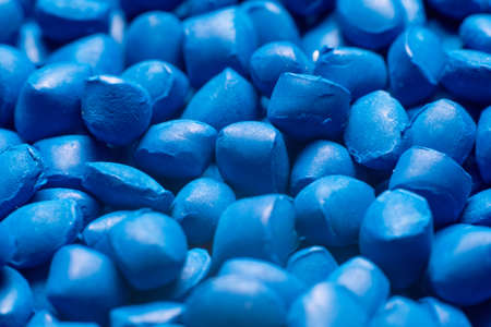 Blue polymer dye in granules, background texture.の写真素材