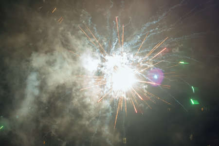 Beautiful colorful fireworks against a dark sky background. Selective focus, background, texture.