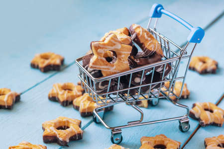 Star shaped shortbread in a small metal cart from a supermarket.の写真素材