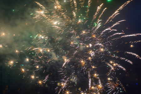 Beautiful colorful fireworks against a dark sky background. Selective focus, background, texture.の写真素材