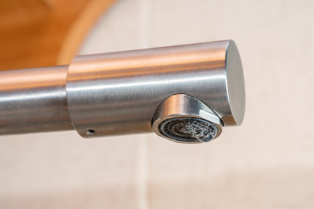 A drop of water drips from a leaky faucet.の写真素材