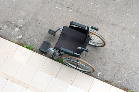 Top view of a wheelchair near the stairs. Wheel chairs for patients.の写真素材
