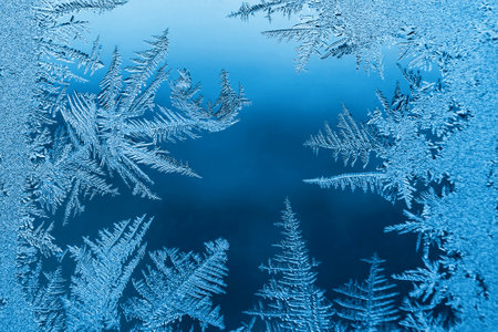 Abstract frosty pattern on glass, background texture.の写真素材