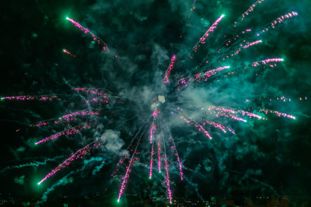 Festive colorful fireworks in the night sky, abstract background.の写真素材