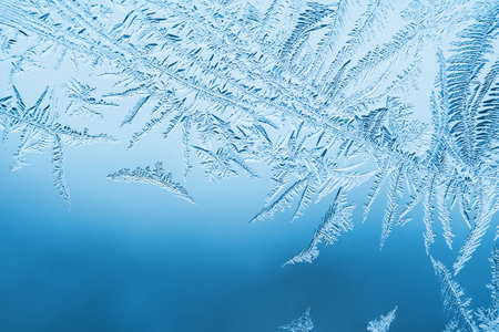 Abstract frosty pattern on glass, background texture.