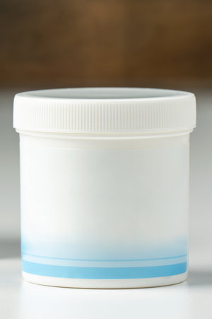 White plastic jar with cream, cosmetic product.の写真素材