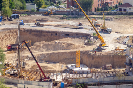 Aerial view of construction site, construction of new building in residential area.