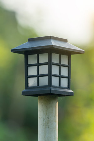 Solar powered garden light in summer garden.の写真素材