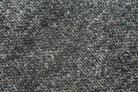 Closeup Macro of Dark Knitted Fabric Texture.