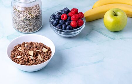 Muesli with berries on the tableの写真素材
