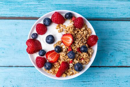 Muesli with greek yogurt on the tableの写真素材