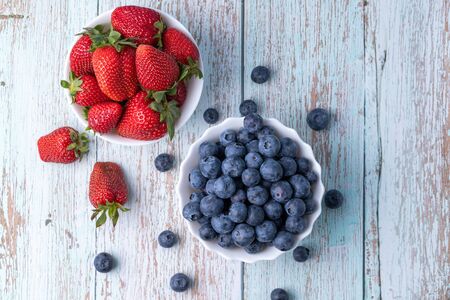 Berries, summer fruits on a wooden table. Healthy lifestyle concept.の写真素材