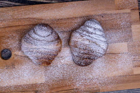 Sweet buns sprinkled with powdered sugarの写真素材