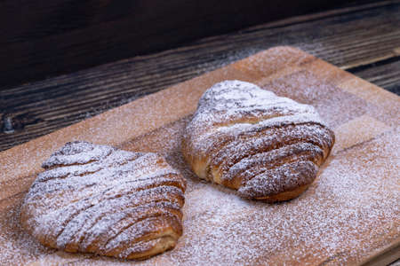 Sweet buns sprinkled with powdered sugarの写真素材