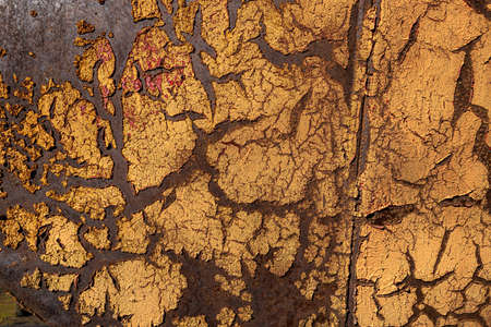 Rusty metal, peeling paint, yellow tones, bright colors.の写真素材