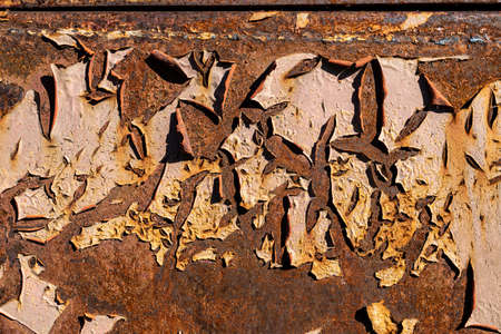 Rusty metal, peeling paint, yellow tones, bright colors.の写真素材