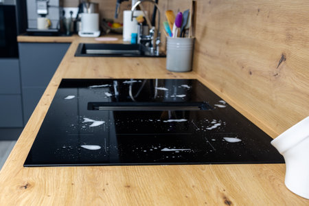 Kitchen sink and faucet on wooden table in modern kitchenの写真素材
