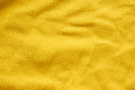 yellow cotton material textile fabric texture backgroundの写真素材