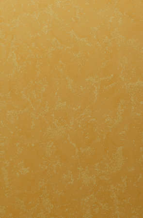 orange yellow plaster wall background texture reliefの写真素材