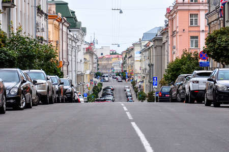 Street with old buildings and parked cars in the city center of Minsk, Belarusのeditorial素材
