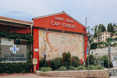 Saint-Jean-Cap-Ferrat, France - 01 June 2023:  Beautiful painted facade of the building at the entrance to the peninsula of Saint Jean Cap Ferratのeditorial素材