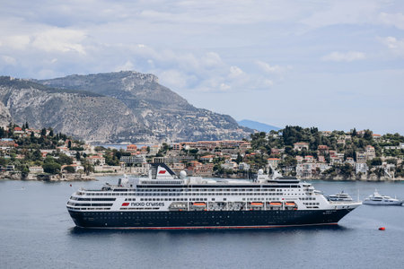 Villefranche-sur-Mer, France - 18 May 2023: Large cruise ship and Saint-Jean-Cap-Ferrat peninsula in the backgroundのeditorial素材
