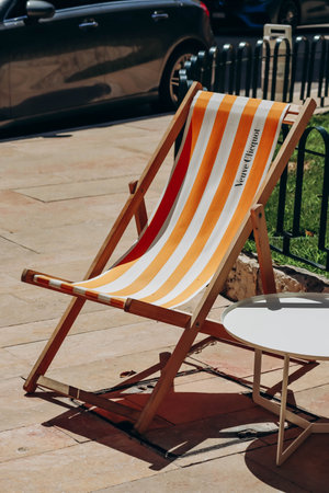 Monaco, Monaco - 25 June 2023: Chaise lounge branded Veuve Clicquot near the hotel Hermitage in...