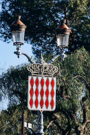 Coat of arms of Monaco, as well as flags of the Principality