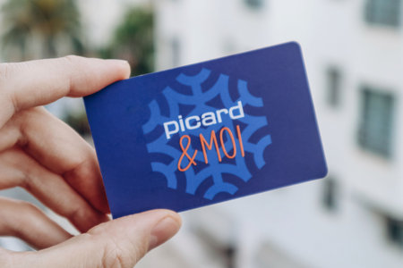 Nice, France - 27.01.2024: A man's hand holds a card of the Picard store chain