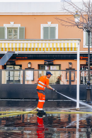 Nice, France - 28 January 2024: A cleaner cleans the Cours Saleya in Nice after the Sunday marketのeditorial素材
