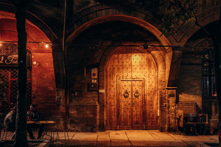 Bologna, Italy - October 6, 2024: Old street in the evening in Bolognaのeditorial素材
