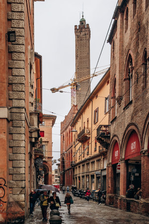 Bologna, Italy - October 6, 2024: The Towers of Bologna, a group of medieval structures in Bologna, Italy. The two most prominent ones remaining, Asinelli and Garisenda, are a landmark of the city.のeditorial素材