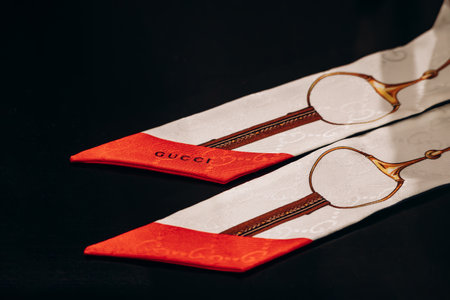 Bologna, Italy - October 6, 2024: Silk twilly scarf Gucci in boutiqueのeditorial素材