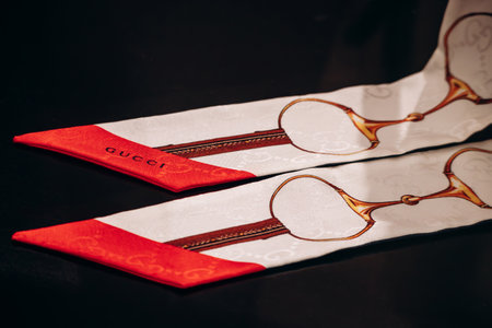 Bologna, Italy - October 6, 2024: Silk twilly scarf Gucci in boutiqueのeditorial素材