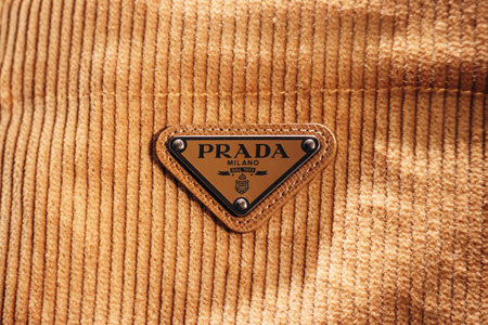 Bologna, Italy - October 6, 2024:  Prada enameled metal triangle logoのeditorial素材